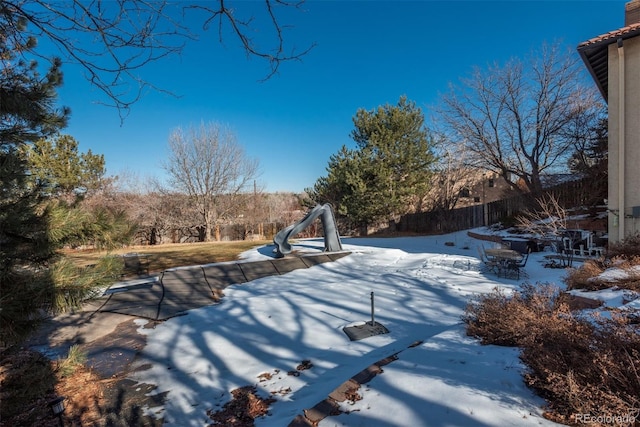 view of yard layered in snow