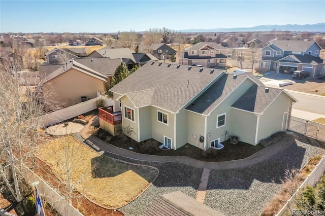 birds eye view of property with a residential view