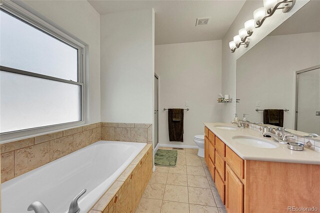 full bathroom featuring a stall shower, a sink, a bath, and tile patterned floors