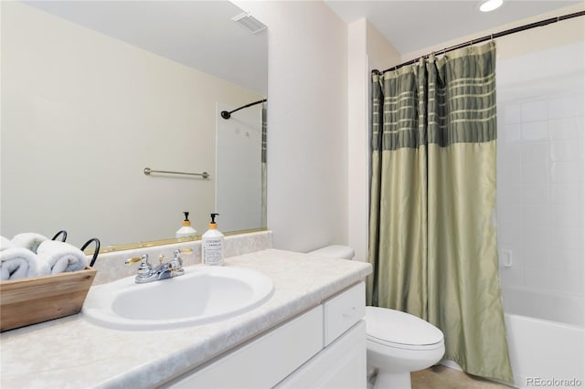 full bath featuring toilet, visible vents, shower / bath combo with shower curtain, and vanity