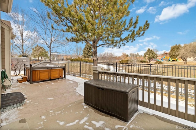 view of patio / terrace featuring a fenced backyard and a hot tub