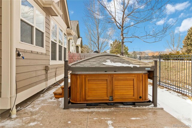 exterior space featuring fence and an outbuilding