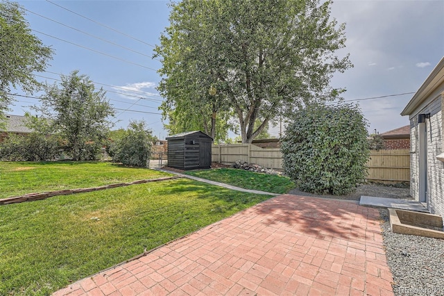 view of patio / terrace with a fenced backyard, a storage unit, and an outdoor structure