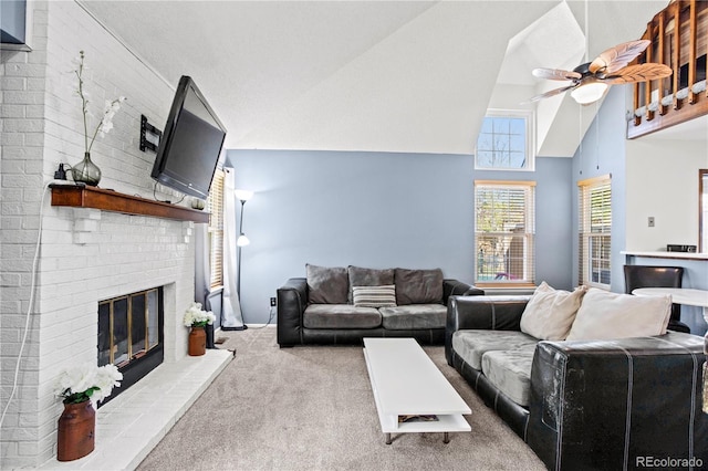 carpeted living room featuring a ceiling fan, high vaulted ceiling, and a fireplace