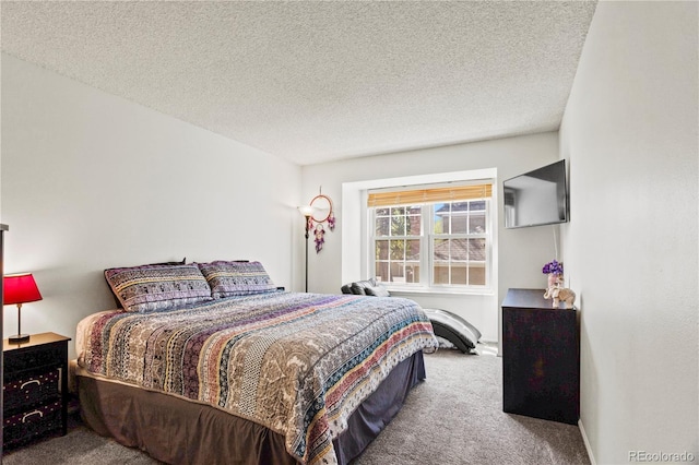 carpeted bedroom with a textured ceiling