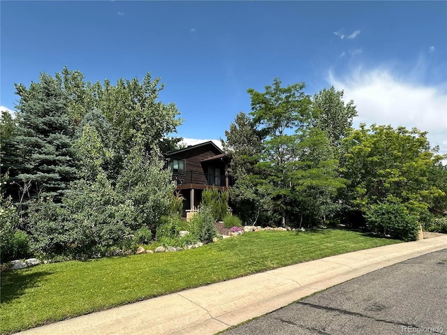 7454 Queen Cir, Arvada, CO 80005 - obstructed view of property with a front yard and a balcony