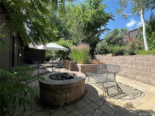 7454 Queen Cir, Arvada, CO 80005 - view of patio with an outdoor fire pit