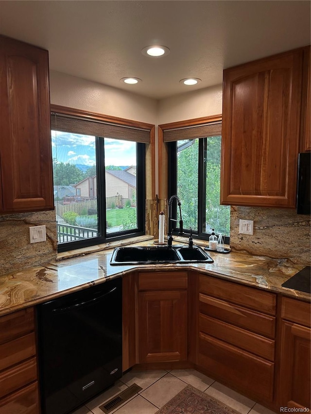 7454 Queen Cir, Arvada, CO 80005 - kitchen featuring dishwasher, backsplash, light tile patterned floors, light stone countertops, and recessed lighting
