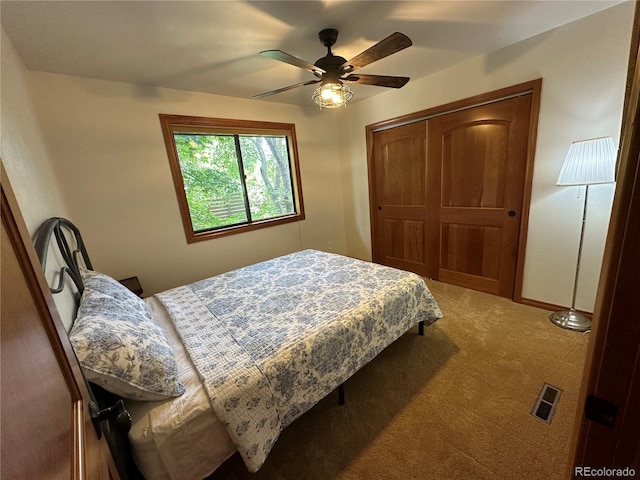 7454 Queen Cir, Arvada, CO 80005 - carpeted bedroom with a closet and a ceiling fan