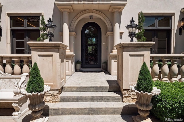 9171 E Harvard Ave, Denver, CO 80231 - doorway to property with stucco siding and french doors