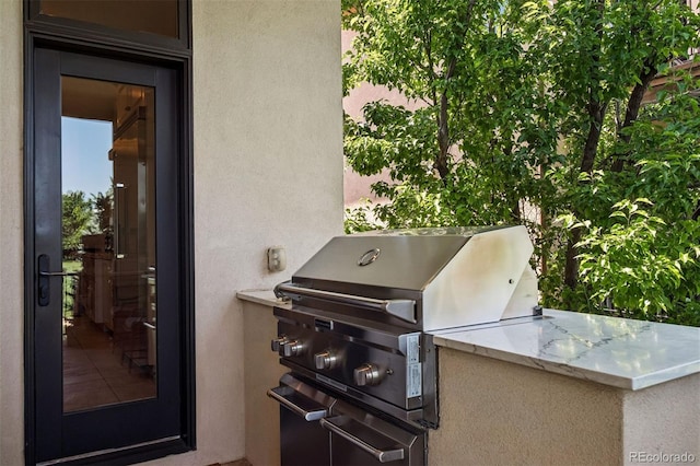 9171 E Harvard Ave, Denver, CO 80231 - view of patio featuring exterior kitchen