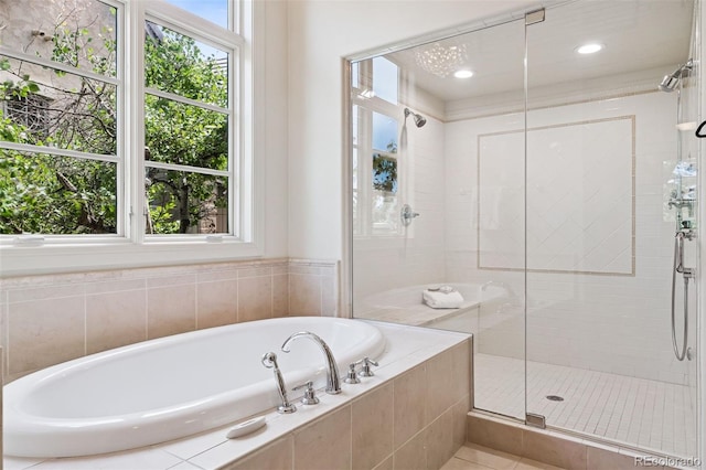 9171 E Harvard Ave, Denver, CO 80231 - full bathroom featuring a shower stall, a garden tub, and tile patterned flooring