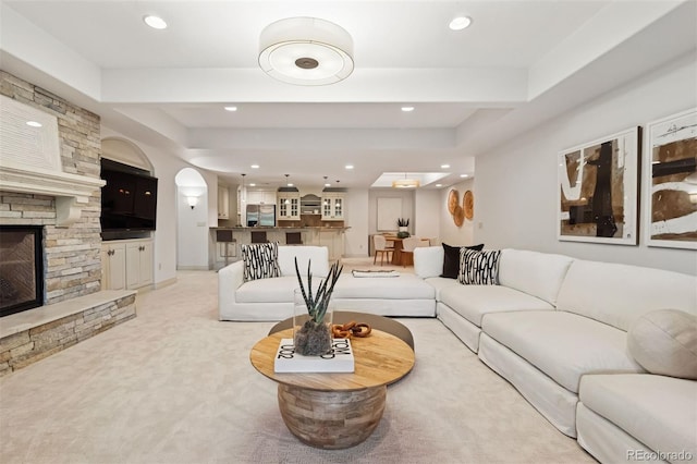 9171 E Harvard Ave, Denver, CO 80231 - living area with a fireplace, light carpet, and recessed lighting