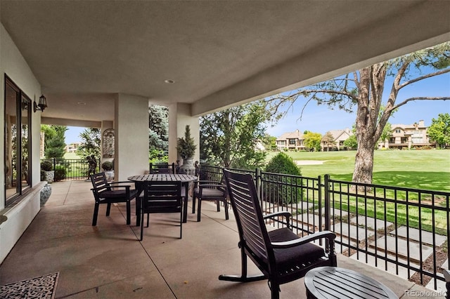 9171 E Harvard Ave, Denver, CO 80231 - view of patio featuring a residential view, outdoor dining area, and view of golf course