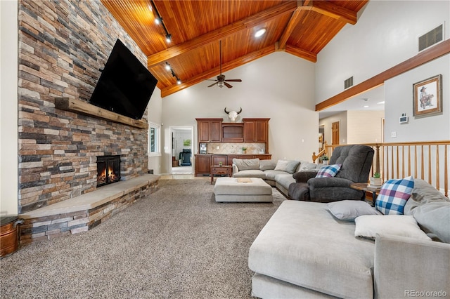 living room featuring wooden ceiling, ceiling fan, high vaulted ceiling, and visible vents