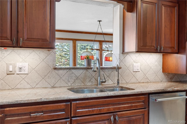 kitchen with light countertops, decorative backsplash, a sink, and dishwasher