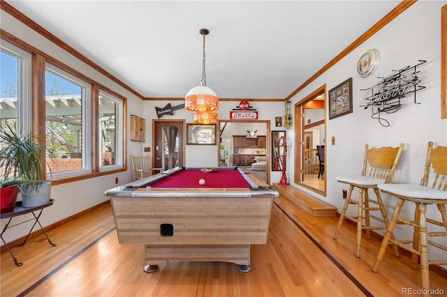 playroom with billiards, ornamental molding, baseboards, and light wood-type flooring
