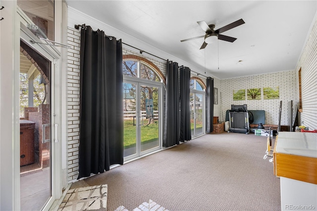 sunroom / solarium featuring french doors