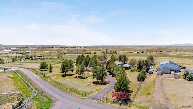 birds eye view of property featuring a rural view