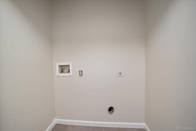 laundry room with hookup for an electric dryer, hookup for a washing machine, and baseboards