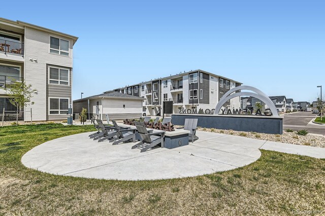 6153 N Ceylon St Unit 303, Denver, CO 80249 - view of patio featuring a fire pit