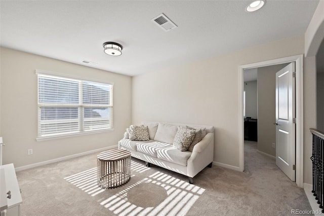 living room with light colored carpet