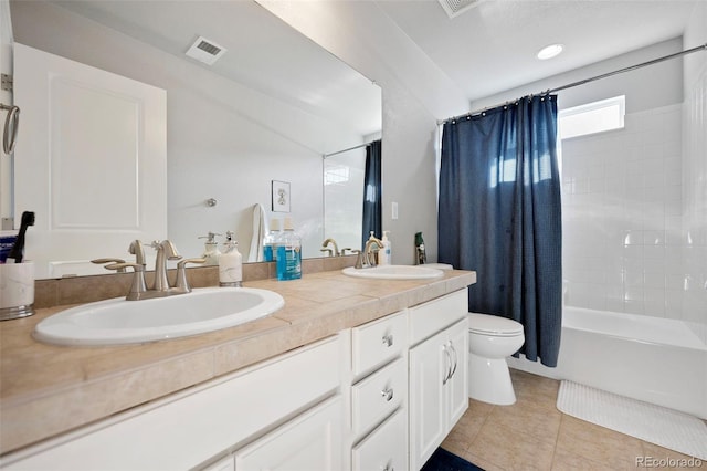 full bathroom featuring shower / tub combo with curtain, vanity, toilet, and tile patterned flooring