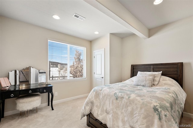 carpeted bedroom featuring beamed ceiling