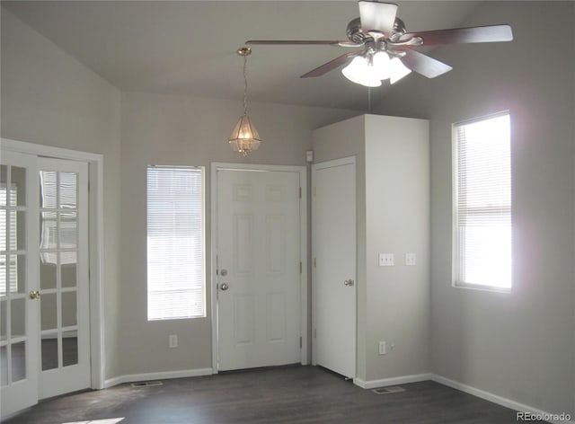 entrance foyer with dark hardwood / wood-style floors, a wealth of natural light, and ceiling fan