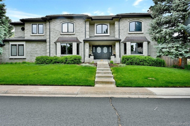 5329 S Geneva St, Englewood, CO 80111 - view of front of house featuring fence and a front lawn