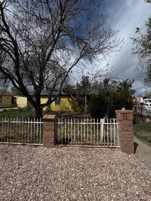 view of gate featuring fence
