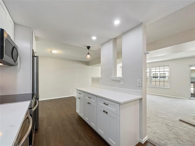 kitchen with white cabinets and dark hardwood / wood-style flooring