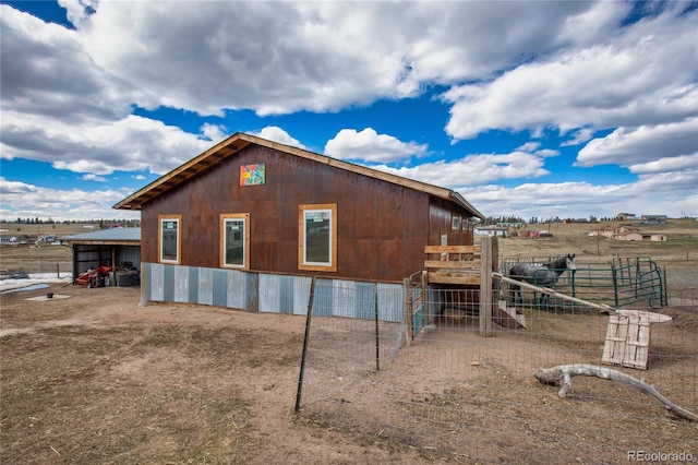 view of side of property with a rural view