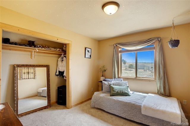 carpeted bedroom featuring a closet