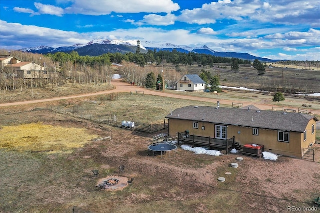 drone / aerial view with a mountain view and a rural view