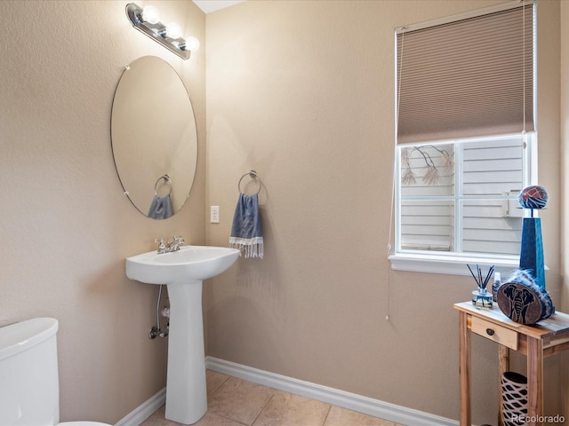 7400 W Grant Ranch Blvd Unit 19, Littleton, CO 80123 - half bathroom featuring tile patterned flooring, toilet, and baseboards
