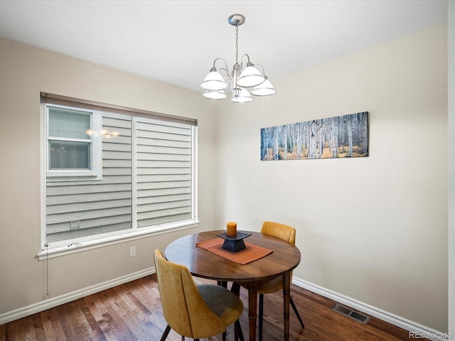 7400 W Grant Ranch Blvd Unit 19, Littleton, CO 80123 - dining area featuring a chandelier, baseboards, and wood finished floors