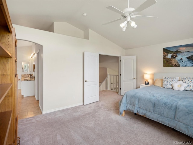 7400 W Grant Ranch Blvd Unit 19, Littleton, CO 80123 - bedroom with vaulted ceiling, light carpet, baseboards, and ceiling fan