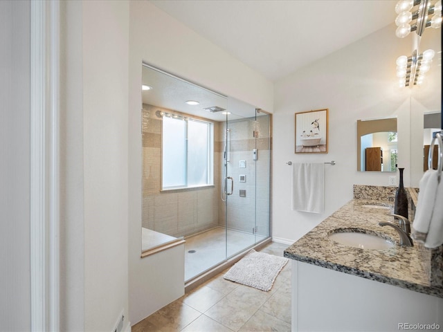 7400 W Grant Ranch Blvd Unit 19, Littleton, CO 80123 - full bath with double vanity, a stall shower, and tile patterned flooring