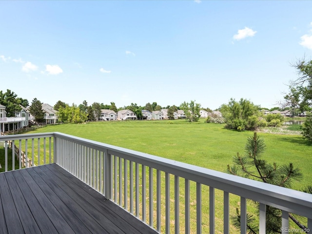 7400 W Grant Ranch Blvd Unit 19, Littleton, CO 80123 - wooden deck featuring a residential view and a lawn