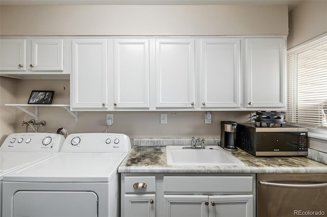 laundry room with sink and washing machine and clothes dryer