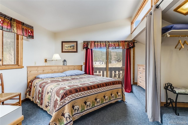 carpeted bedroom featuring access to exterior and lofted ceiling