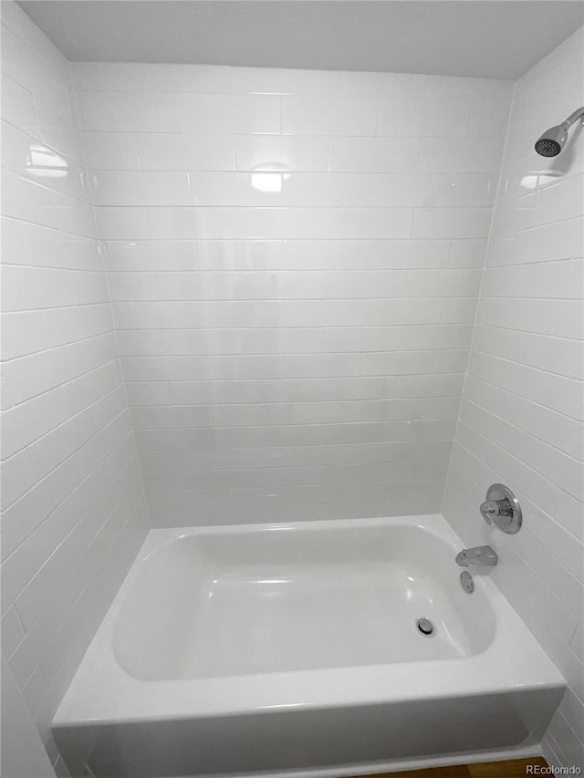 bathroom with shower / tub combination