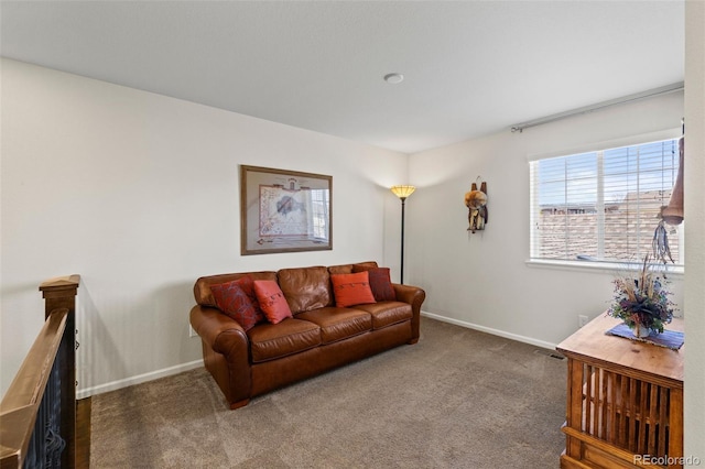 living room featuring carpet flooring and baseboards