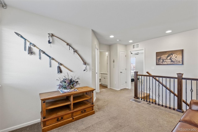hallway with recessed lighting, an upstairs landing, carpet flooring, and baseboards