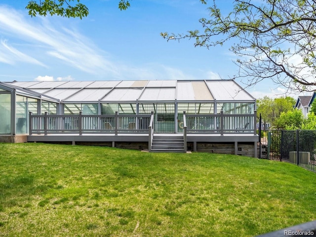 back of house featuring a wooden deck