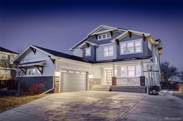 785 Delechant Dr, Erie, CO 80516 - craftsman inspired home featuring a porch, concrete driveway, stone siding, and an attached garage