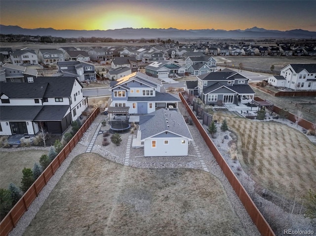 785 Delechant Dr, Erie, CO 80516 - aerial view at dusk of a residential view and a mountain view