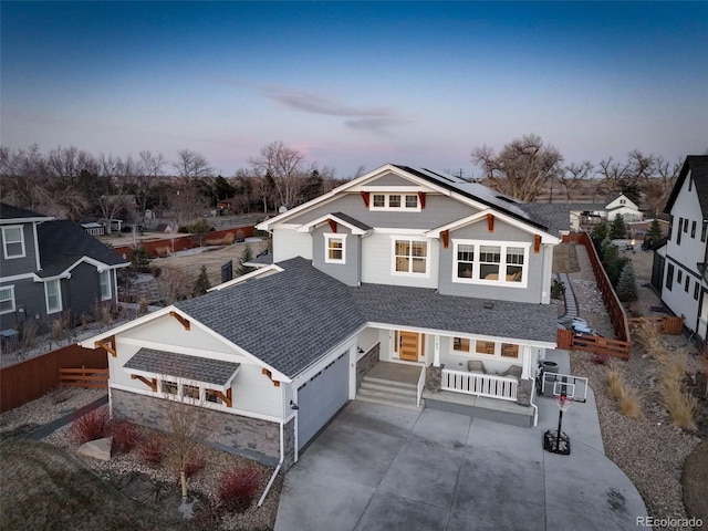 785 Delechant Dr, Erie, CO 80516 - craftsman inspired home with solar panels, roof with shingles, concrete driveway, and covered porch