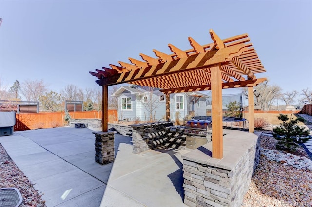 785 Delechant Dr, Erie, CO 80516 - view of patio featuring a trampoline and a pergola